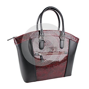 Female red black reptile skin leather handbag isolated on white