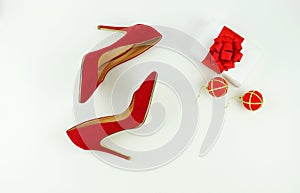 Female red heels shoes on white background