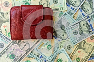 Women`s wallet on dolar notes.