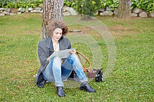 Female redhead art student drawing outdoors