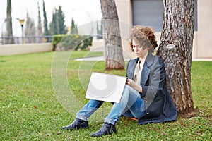 Female redhead art student drawing outdoors