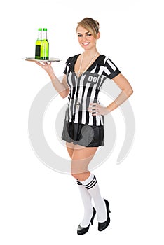 Female referee carrying drinks