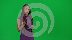 Female reporter isolated on chroma key green screen background. African American woman news host in dress talking