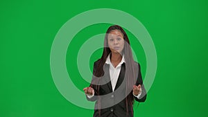 Female reporter isolated on chroma key green screen background. African American woman news host in suit talking