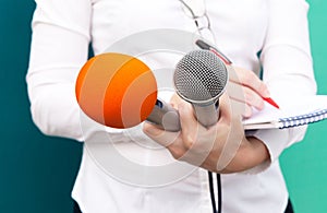 Female reporter or journalist at press conference