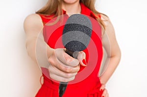Female reporter at press conference with microphone