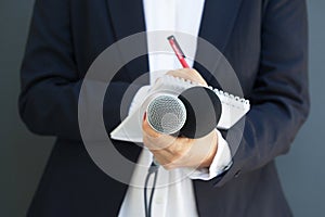 Woman journalist or reporter at news conference. Journalism concept. photo