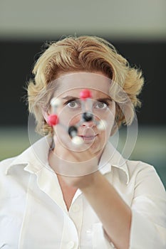 Female researcher analyzing a molecular structure