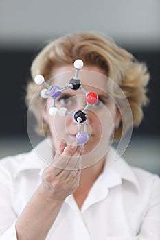 Female Researcher Analyzing A Molecular Structure