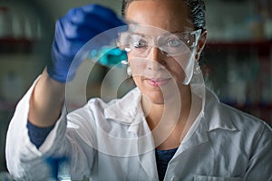 Female researcher carrying out scientific research in a lab