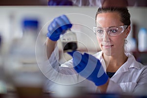 Female researcher carrying out scientific research in a lab