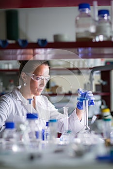Female researcher carrying out scientific research in a lab