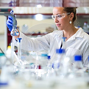 Female researcher carrying out scientific research in a lab