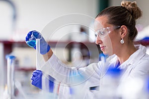 Female researcher carrying out scientific research in a lab