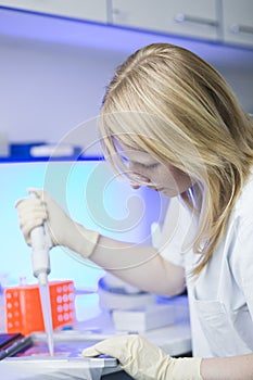 Female researcher doing research in a lab