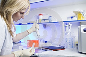 Female researcher doing research in a lab