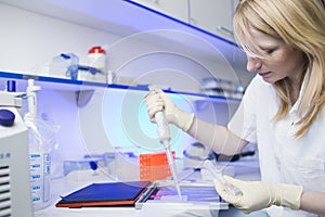 Female researcher doing research in a lab