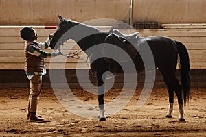 Female Rider with Horse in Arena