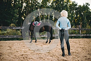 Female rider trains her horse, horseback riding