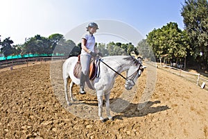 Female rider trains the horse