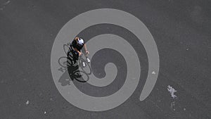 Female road cyclist riding on the street