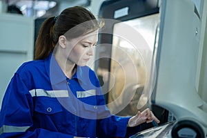 Female Robotics engineers Using Controller to Remotely Operate programming and Manipulating Robot Hand, Industrial Robotics Design