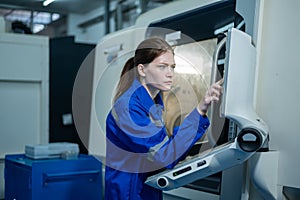 Female Robotics engineers Using Controller to Remotely Operate programming and Manipulating Robot Hand, Industrial Robotics Design