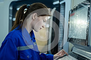 Female Robotics engineers Using Controller to Remotely Operate programming and Manipulating Robot Hand, Industrial Robotics Design