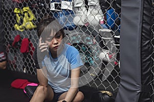 A female rookie athlete calls her friends and tell them that she is nervous about the mixed martial arts competition she entered