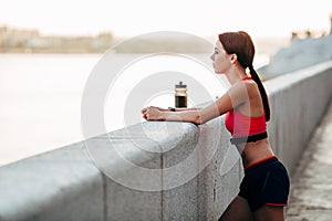 Female runner with bottled water