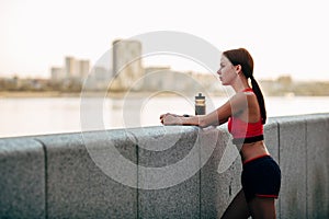 Female runner with bottled water