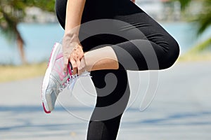 Female runner leg and muscle pain during running outdoors