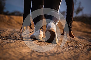 Female runner running on a forest trail. Woman athlete jogging in the mountain. Workout wellness concept