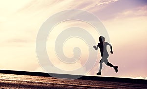 Female Runner Silhouette, Woman Running into sunset