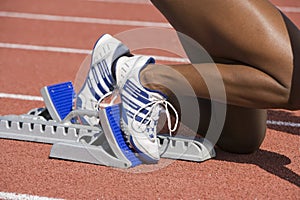 Female Runner On Starting Blocks