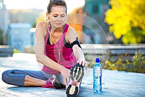 Female Runner Stretching