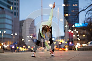 Female runner stretching before jog