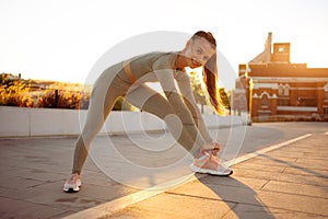 Female runner stretching before running