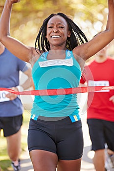 Female Runner Winning Marathon