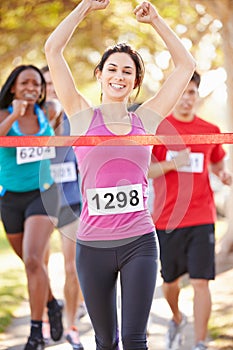 Female Runner Winning Marathon