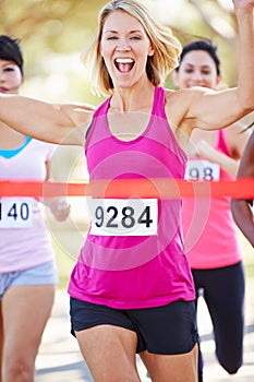 Female Runner Winning Marathon