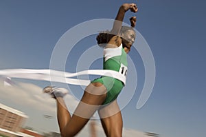 Female Runner Winning Race