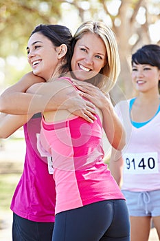 Female Runners Congratulating One Another After Race photo