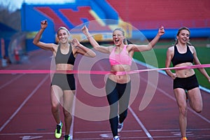 Female Runners Finishing Race Together