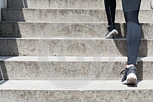 Female running up stairs