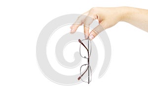 Female`s hand holding glasse on white background. Glasses in han
