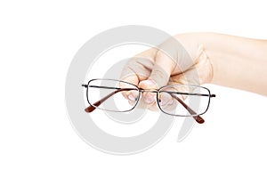 Female`s hand holding glasse on white background. Glasses in han