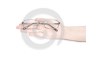 Female`s hand holding glasse on white background. Glasses in han