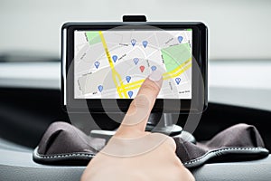 Female`s Hand Using GPS Navigation