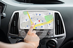 Female`s Hand Using GPS Navigation